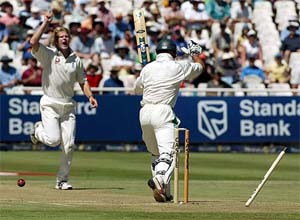 England's Matthew Hoggard (left) celebrates after dismissing South African opener Herschelle Gibbs on the opening day of the third Test in Cape Town on Sunday