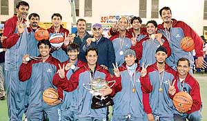 Members of the Uttaranchal team in a jubilant mood after winning the title in the 55th Dhanoa Senior National Basketball Championship in Ludhiana on Sunday.