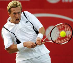 Sweden's Jonas Bjorkman hits a shot during his first round match against India's Karan Rastogi in the ATP Tour Chennai Open