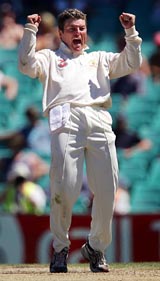 Australia's Stuart MacGill celebrates taking the wicket of Pakistan's Danish Kaneria for a duck during the third Test at the Sydney Cricket Ground
