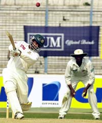 Bangladeshi cricketer Rajin Mohammad Rafique plays a shot to the boundary during the first Test match between Bangladesh and Zimbabwe