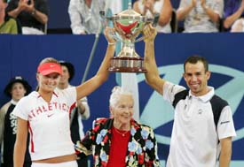 Dominik Hrbaty and Daniela Hantuchova of Slovakia hold the Hopman Cup after defeating Argentine pair of Guillermo Coria and Gisela Dulko 