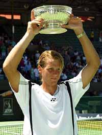 Joachim Johansson of Sweden holds aloft the trophy after defeating Taylor Dent of USA in the final of the Australian men�s hardcourt tennis championship