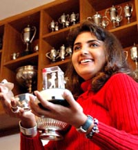 Golfer Irina Brar shows the trophies recently won by her to mediapersons in Chandigarh on Monday