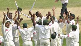 Bangladesh players celebrate after beating Zimbabwe in Chittagong on Monday to record their first win in Test cricket