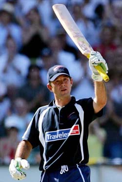 World XI captain Ricky Ponting celebrates on reaching his century against Asia XI in Melbourne on Monday