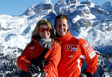 In this photo released by Ferrari Media, F1 world champion Michael Schumacher of Germany poses with his wife Corinna in Madonna di Campiglio