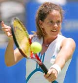 Switzerland's Patty Schnyder plays a backhand against Russia's Elena Dementieva during a quarterfinal match at the Sydney International tennis tournament