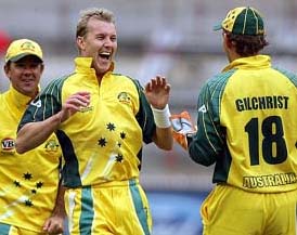 Australia's Brett Lee celebrates with Adam Gilchrist as captain Ricky Ponting looks on after dismissing West Indies batsman Xavier Marshall for five runs during the one-day match