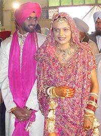 International hockey player Kanwalpreet Singh with his wife Gultaj Kaur