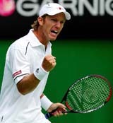 Sweden's Thomas Johansson reacts after winning a point against Australia's Peter Luczak at the Australian Open 