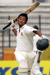 Bangladesh batsman Nafis Iqbal reacts after completing his century during the fifth day of the second Test against Zimbabwe in Dhaka on Tuesday