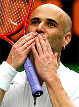 Andre Agassi of the US blows kisses to the crowd following his second round victory over Germany's Rainer Schuettler 