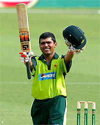 Pakistani batsman Kamran Akmal celebrates after scoring his maiden ODI century against the West Indies in Melbourne on Wednesday