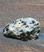 In this image released on Wednesday, NASA’s Mars Exploration Rover “Opportunity” has found an iron meteorite on Mars, the first meteorite of any type ever identified on another planet. The pitted, basketball-size object is mostly made of iron and nickel. This composite combines images taken through the panoramic camera’s 600-nanometer (red), 530-nanometer (green), and 480-nanometer (blue) filters.