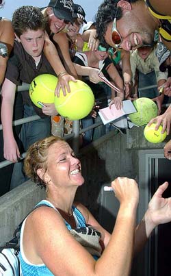 Top seed Lindsay Davenport of the USA signs autographs after her second round victory over Czech Republic's Michaela Pastikova at the Australian Open tennis tournament in Melbourne