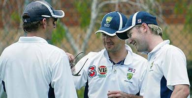 Australian cricketers Adam Gilchrist (left), Michael Clark (right) and team captain Ricky Ponting enjoy a light moment during training in Brisbane, Australia, Thursday