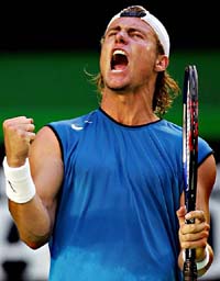 Australia�s Lleyton Hewitt celebrates his victory over Spain�s Rafael Nadal at the Australian Open in Melbourne on Monday