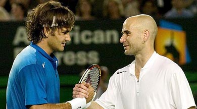 Roger Federer of Switzerland shakes hands with Andre Agassi of the USA after their quarter-final match at the Australian Open in Melbourne on Tuesday