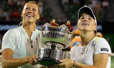 Australia�s Alicia Molik and Russia�s Svetlana Kuznetsova hold the trophy after the women�s doubles final at the Australian Open in Melbourne