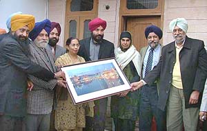 Canadian MP Navdeep Singh Bains (fourth from right) being honoured at the residence of Lok Sabha Deputy Speaker Charanjit Singh Atwal in Ludhiana on Friday.
