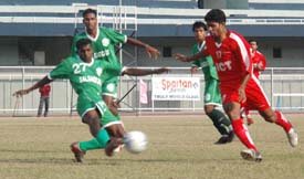 Jyoti Kumar of Salgaocar Sports Club, Goa, and Manjeet Singh of JCT Mills battle for the ball during a National Football League match