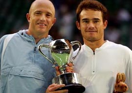 Kevin Ullyett and Wayne Black of Zimbabwe hold the trophy after winning the men�s doubles final against Bob Bryan and Mike Bryan of the USA at the Australian Open
