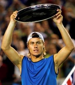 Australia's Lleyton Hewitt lifts the runner-up trophy after being defeated by Russia's Marat Safin 