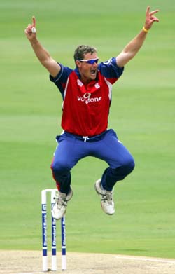 England's Ashley Giles celebrates as he takes the wicket of South Africa's Justin Kemp for 24