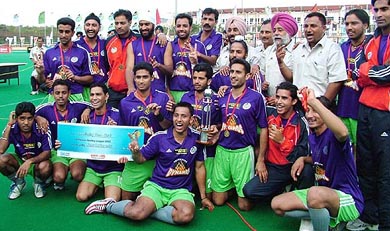 The victorious Chandigarh Dynamos team with the Premier Hockey League trophy. They defeated Delhi Dazzlers at Hyderabad on Sunday