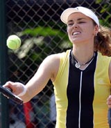 Former world tennis number one Martina Hingis practices at Pattaya City, about 120 km southeast of Bangkok on Monday