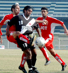 Alex Ambrose (10) of Vasco Sports Club of Goa being tackled by JCT players during the National Football League match played at Guru Nanak Stadium at Ludhiana