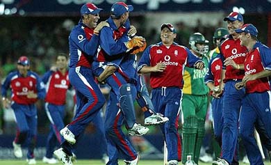England wicketkeeper Geraint Jones, with pads, is lifted by his teammates after dismissing South Africa's Andrew Hall on the last ball and the last run of the match