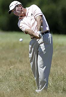 Australia�s Peter Lonard hits a shot on the 10th hole on the second day of the Heineken Classic at Royal Melbourne Golf Club in Melbourne on Friday. Lonard joined Briton Colin Montgomerie at the top of the leaderboard.