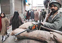 Securitymen keep tight vigil at Anantnag in South Kashmir region as people exercised their franchise for the third phase of civic election on Sunday.