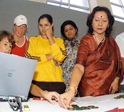 Indian tennis sensation Sania Mirza with Andhra Pradesh Sports Minister Geeta Reddy (R) during the draw for the Hyderabad Open on Sunday. 