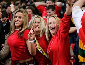 Wales fans celebrate their team's victory over England