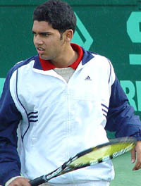Navinder Pal Singh of India in action during his singles match against Aleksey Namozov of Uzbekistan on the first day of the SAIL ITF Junior Grade 3 Tennis Tournament