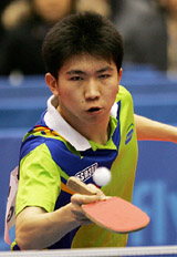 South Korean Ryu Seung-min, table tennis gold medalist at the 2004 Athens Olympics, hits a return against Kalinikos Kreanga