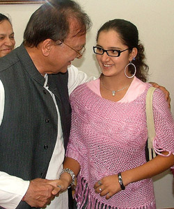 Sports Minister Sunil Dutt greets tennis star Sania Mirza during a meeting in New Delhi on Thursday