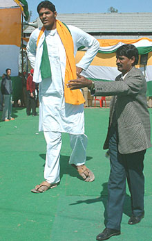 Eighteen-year-old Vikas, who stands 8.4 feet, campaigns for the Congress in Ajnala on Sunday.