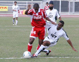Julius Irabor of JCT Mills and Marcos Pereira of Churchill Brothers fight for the ball during a National Football League match in Ludhiana