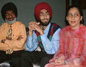 Prabir Singh (centre) along with his parents at his residence in Amritsar on Tuesday. He was kidnapped by an inter-state gang on February 7.