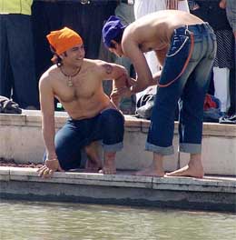 Film actor Aamir Khan shoots for his forthcoming Hindi movie �Rang de Basanti� at the sarovar of Golden Temple in Amritsar on Friday. 