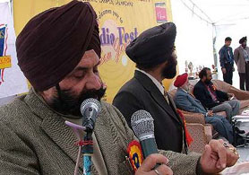 Mr B.I.S. Chahal, Media Adviser to Punjab Chief Minister, reads his speech on the regional campus of the GND University at Ladhewali village in Jalandhar on Saturday.