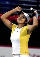 Sania Mirza celebrates her victory over Jelena Kostanic of Croatia during the  opening round of the Dubai Open in Dubai on Monday