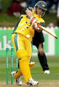 Australia�s Adam Gilchrist hits a boundary off New Zealand bowler Lance Hamilton during the fourth ODI
