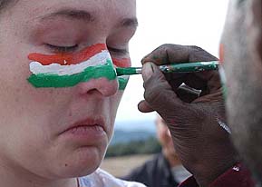 A German woman gets Indian Flag painted on her face in Dharamsala