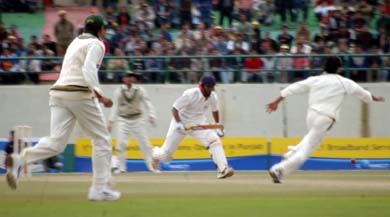 Board President�s XI batsman Dheeraj Jadhav goes for a run on the third and final day of the match against Pakistan in Dharamsala on Saturday