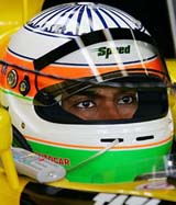 Narain Karthikeyan waits for the second qualifying session at the Australian Grand Prix in Melbourne on Sunday